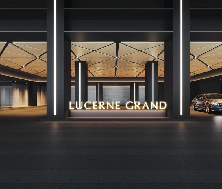 Lucerne Grand arrival drop-off with the illuminated project name — artist's impression